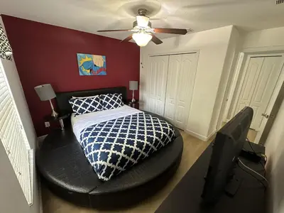 a bedroom with a bed and a ceiling fan at SHVPP1 - Paradise Palms #1 - 6 Bed 5 Baths Villa in Kissimmee