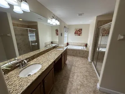 a large bathroom with two sinks and a shower at SHVPP1 - Paradise Palms #1 - 6 Bed 5 Baths Villa in Kissimmee