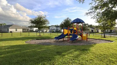 a playground with a slide in a park at SHVCC2 - Crystal Cove #2 - 7 Bed 4.5 Baths Villa in Kissimmee