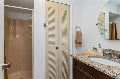 a bathroom with a sink and a mirror at Cozy Townhome in Fantasy World Near Parks in Kissimmee
