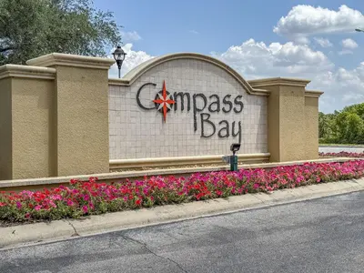 a sign for the entrance to aissociation at Spacious Lakefront Townhouse 10 Mins To Disney in Kissimmee