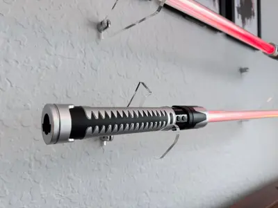 a black flashlight is hanging on a wall at Cozy 3Br Villa With Pool Disney Nearby in Orlando