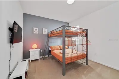 a bedroom with two bunk beds in a room at Luxury Family Villa With Pool & Bbq Near Disney! in Kissimmee
