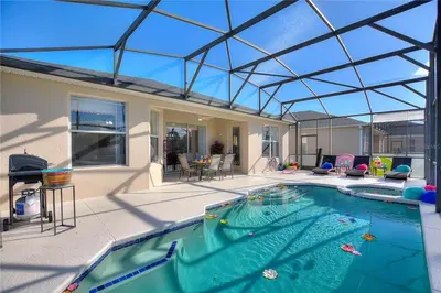 an indoor swimming pool with a glass roof at 4Br Pool Villa, Near Disney - Gated Resort! in Kissimmee