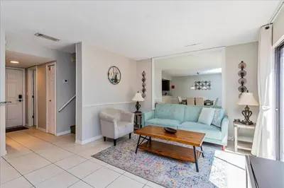 a living room with a blue couch and a table at Spacious Home in FantasyWorld in Kissimmee