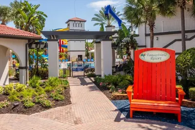 a red bench in front of a resort at Spacious Home in FantasyWorld in Kissimmee