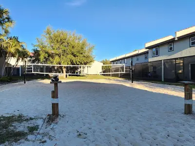 a volley ball court in front of a building at Family vacation Villa in Fantasy World Resort - Minutes from Disney in Kissimmee