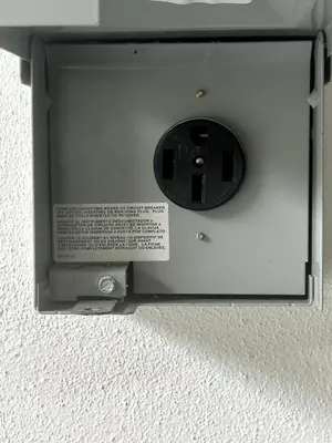 a metal box with a speaker in a wall at Eola Retreat Private Hot Tub with Grill in Orlando
