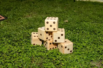 a pile of wooden dominoes sitting on the grass at Eola Retreat Private Hot Tub with Grill in Orlando