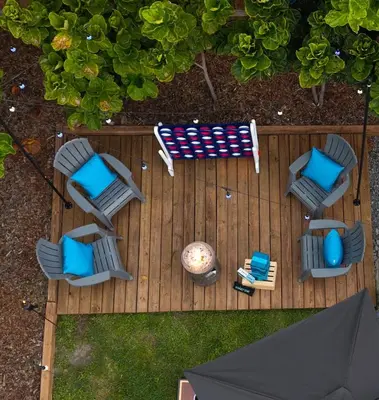 an overhead view of a deck with chairs and an umbrella at Eola Retreat Private Hot Tub with Grill in Orlando