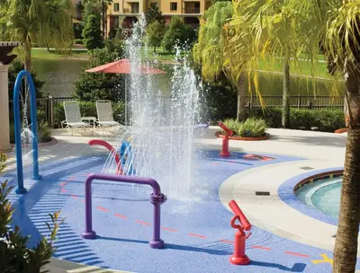 a fountain in the middle of a pool at Wyndham Bonnet Creek 2BR Apartment with Resort Access in Orlando