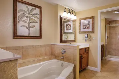 a bathroom with a bath tub and a sink at Wyndham Bonnet Creek 2BR Apartment with Resort Access in Orlando