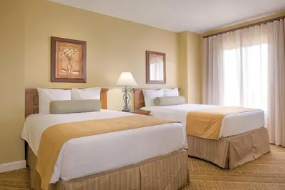 a hotel room with two beds and a window at Wyndham Bonnet Creek 3BR Apartment with Resort Access in Orlando