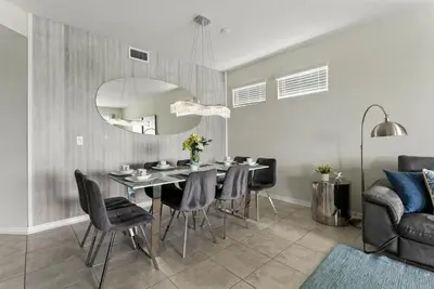 a dining room with a table and chairs at Beautiful Lakeview Retreat Near Disney in Kissimmee