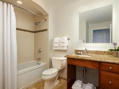 a bathroom with a toilet and a tub and a sink at Sheraton Vistana Villages 2BR Apartment with Resort Access in Orlando
