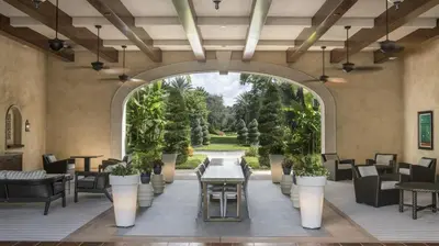 an indoor patio with chairs and tables and an archway at Marriott's Lakeshore Reserve 1BR Apartment with Resort Access in Orlando