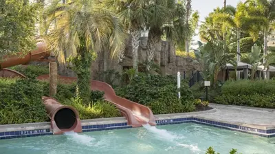 a slide in a pool at a resort at Marriott's Lakeshore Reserve 2BR Villa with Resort Access in Orlando