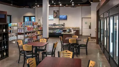 a restaurant with tables and chairs in a store at Marriott's Lakeshore Reserve 3BR Apartment with Resort Access in Orlando