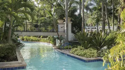 a swimming pool with a bridge in a resort at Marriott's Lakeshore Reserve 3BR Apartment with Resort Access in Orlando