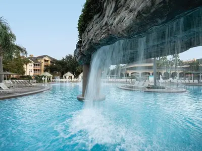 a fountain in the middle of a swimming pool at Sheraton Vistana Resort One Bedroom Apartment in Orlando