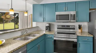 a blue kitchen with a sink and a microwave at Marriott's Sabal Palms 2BR Apartment with Resort Access in Orlando