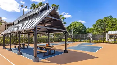 a basketball court with two benches on a basketball court at Marriott's Sabal Palms 2BR Apartment with Resort Access in Orlando