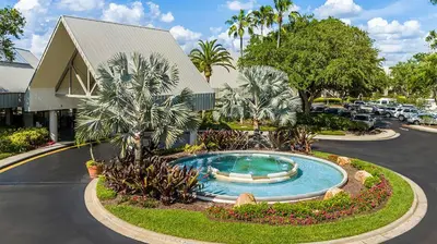 a small pool in the middle of a parking lot at Marriott's Sabal Palms 2BR Apartment with Resort Access in Orlando
