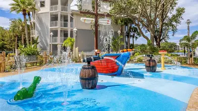 a pool with a water park with a water fountain at Marriott's Cypress Harbour 2BR Apartment with Resort Access in Orlando