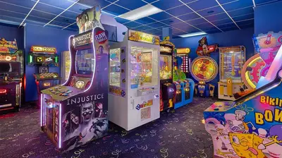 a room with arcade games and video games at Marriott's Cypress Harbour 2BR Apartment with Resort Access in Orlando