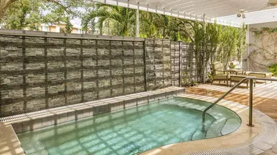 a hot tub in a backyard with a fence at Marriott's Cypress Harbour 2BR Apartment with Resort Access in Orlando