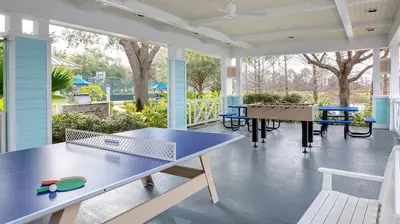 a screened porch with a ping pong table on it at Marriott's Harbour Lake 1BR Apartment with Resort Access in Orlando