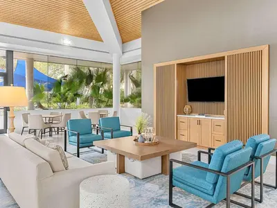 a living room with a couch and a table and chairs at Marriott's Imperial Palms 3BR Apartment with Resort Access in Orlando