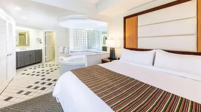 a hotel room with a bed and a bath tub at Marriott's Imperial Palms 3BR Apartment with Resort Access in Orlando