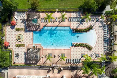an overhead view of a pool at a resort at Charming 3BR Resort Townhome with Private Pool near Disney in Kissimmee