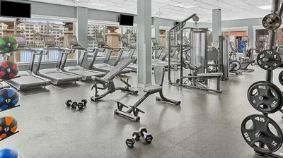 a gym with a bunch of cardio equipment in it at Marriott's Grande Vista 2BR Apartment with Resort Access in Orlando