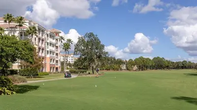 a golf course in front of a large building at Marriott's Grande Vista 3BR Apartment with Resort Access in Orlando