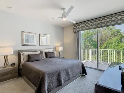 a bedroom with a bed and a large window at Harmony in Orlando