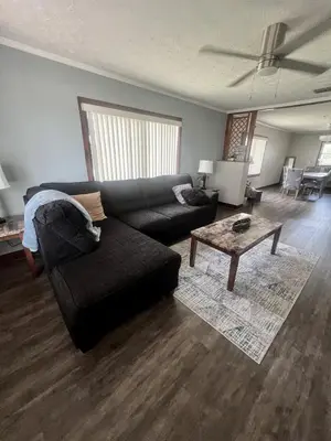 a living room with a couch and a coffee table at Spacious Lake Retreat for Families in Saint Cloud