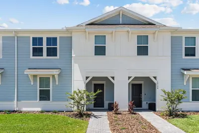 a house with blue and white at Brand NEW 05 Bedrooms At Windsor Cay in Orlando