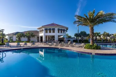 a swimming pool in front of a resort at 2 Bedrooms 2 Bathrooms Storey Lake 3151-404 in Kissimmee