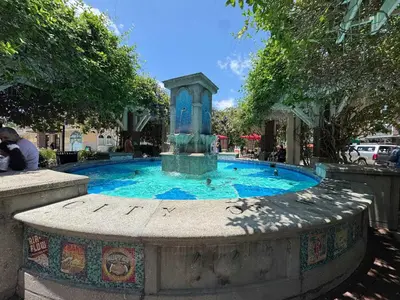 a fountain in the middle of a park at Peace in the Garden - Home in Winter Garden in Orlando
