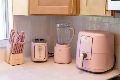 three pink appliances sitting on a kitchen counter at Spacious Modern Japandi Retreat - Winter Park in Orlando