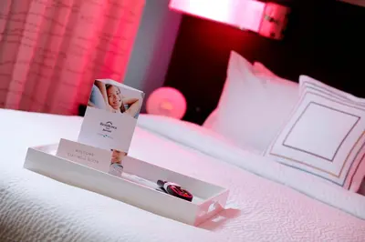 a white bed with two boxes on top of it at Residence Inn by Marriott Orlando Lake Nona in Orlando