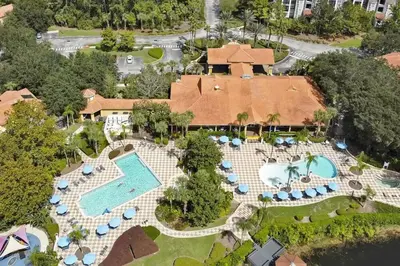 an aerial view of a resort with a swimming pool at NEW - Townhome on amazing resort - private hot tub in Kissimmee