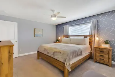 a bedroom with a bed and a window at Go08 - STOREY LAKE in Kissimmee