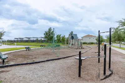 a park with a playground with a swing set at Go08 - STOREY LAKE in Kissimmee