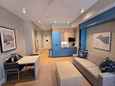 a living room with a couch and a table at Go 29 Margaritaville Studio in Orlando