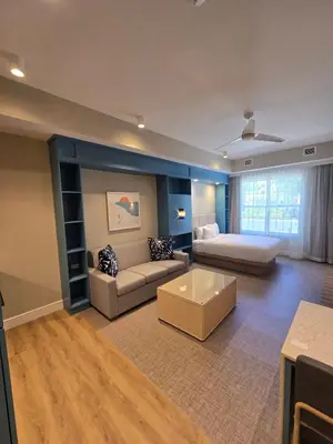 a large living room with a couch and a bed at Go 29 Margaritaville Studio in Orlando