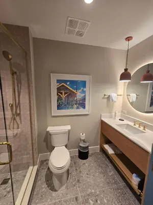 a bathroom with a toilet and a sink at Go 29 Margaritaville Studio in Orlando