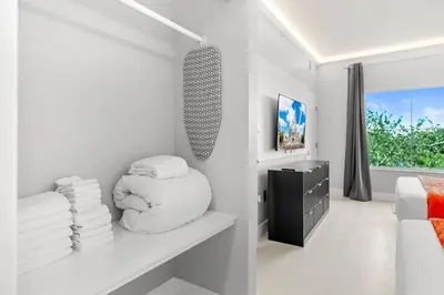 a white room with a bed and a window at 1BR Suite Prime Orlando Location in Orlando